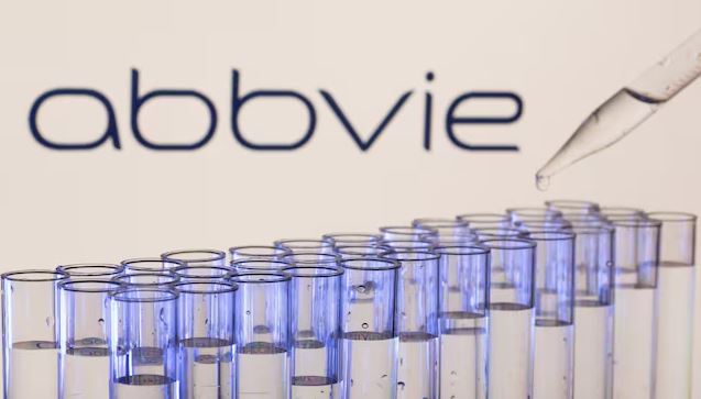 AbbVie logo displayed above laboratory test tubes, illustrating the company's $10.9 billion acquisition of Apogee Therapeutics and expansion into immunology treatments.