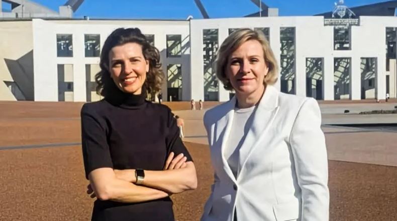 Australian MPs Zali Steggall and Allegra Spender stand outside Parliament House in Canberra during the launch of Community Strong Australia.