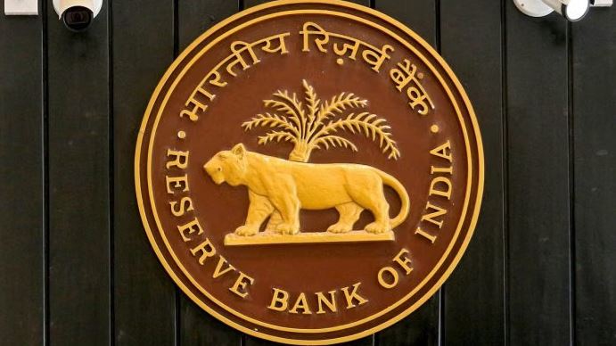 Reserve Bank of India (RBI) official emblem featuring the tiger and palm tree symbol on circular seal plaque mounted on wall.