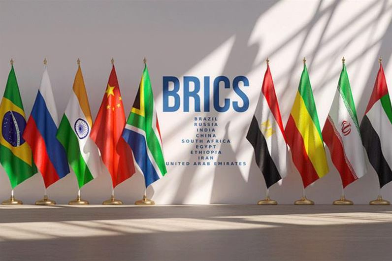 Flags of BRICS nations displayed with the BRICS alliance logo.