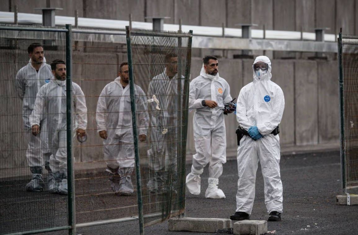 Medical workers in protective gear during quarantine measures linked to the MV Hondius hantavirus outbreak in Europe