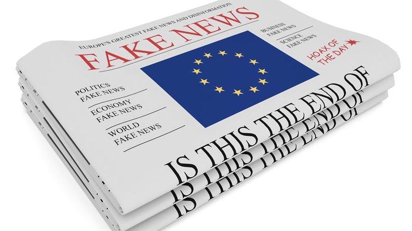 Stack of newspapers labeled fake news featuring EU flag and headlines about misinformation and disinformation in Europe