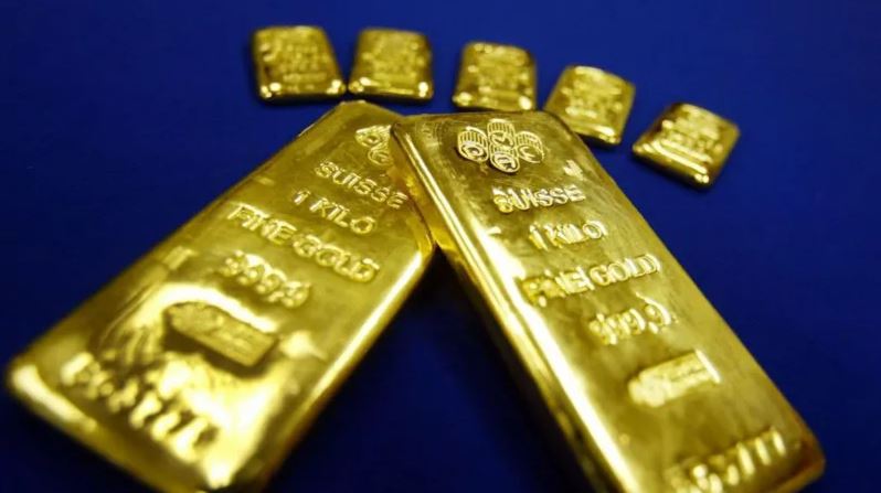 Gold bars displayed during an FBI investigation into a former CIA official accused of hiding more than $40 million worth of gold in his Virginia home.