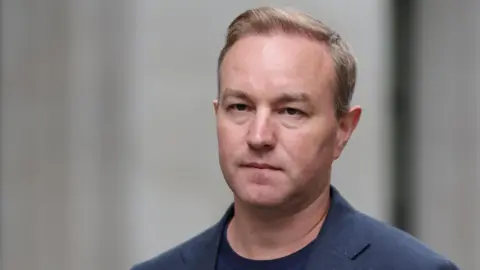 Tom Hayes Libor case: former trader in navy jacket outside court