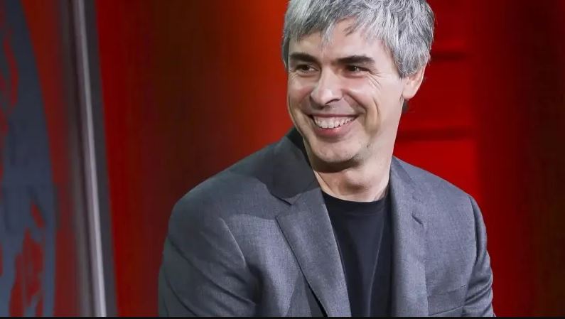 Larry Page smiling during a public appearance, reflecting the Google co-founder and AI technology entrepreneur.