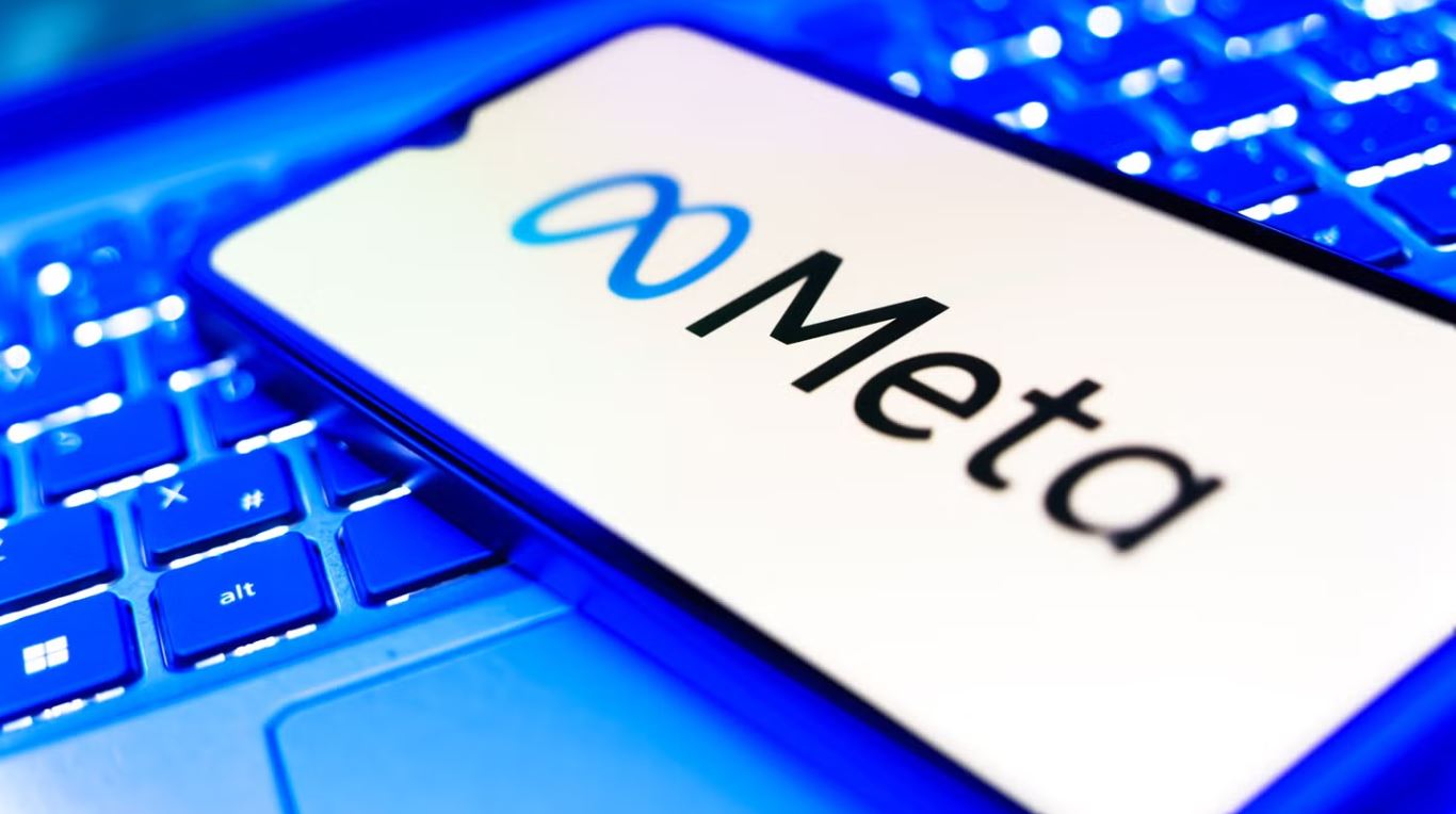 Meta logo displayed on a smartphone screen, representing the company's content moderation policy and online safety debate.