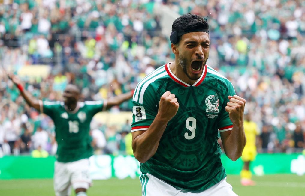 Raúl Jiménez celebrates Mexico goal against South Africa in World Cup 2026 opener at Azteca Stadium.