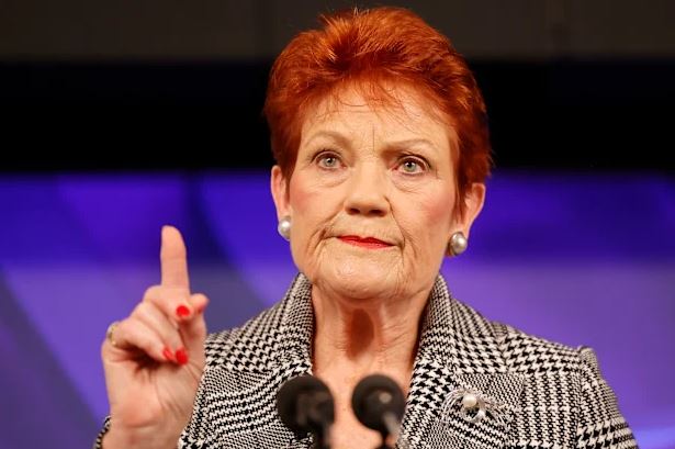 Pauline Hanson speaking at a public event while discussing immigration, housing, and energy policies in Australia