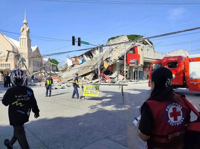 Philippines Earthquake 2026 aftermath showing a collapsed commercial building in General Santos City after the deadly 7.8 magnitude Mindanao earthquake