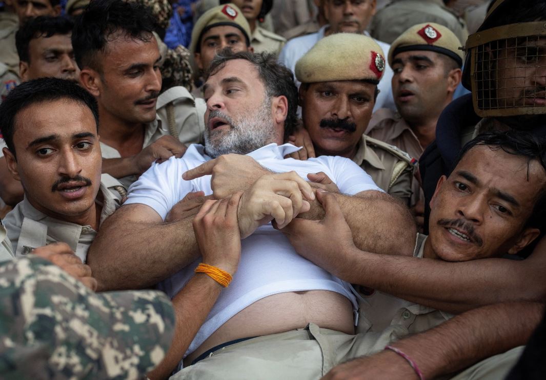 Rahul Gandhi being carried and detained by Delhi Police officers during a protest in New Delhi as student demonstrations intensify.