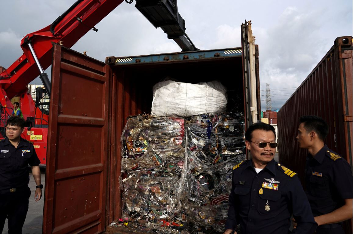 Illegal electronic waste shipment container inspected by Thai customs officials during anti e-waste trafficking operation at port terminal