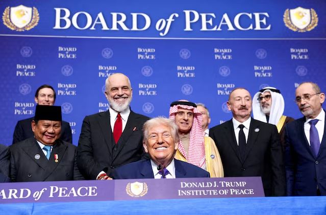 Donald Trump with international leaders at the Board of Peace summit discussing the Gaza ceasefire and Hamas disarmament plan.