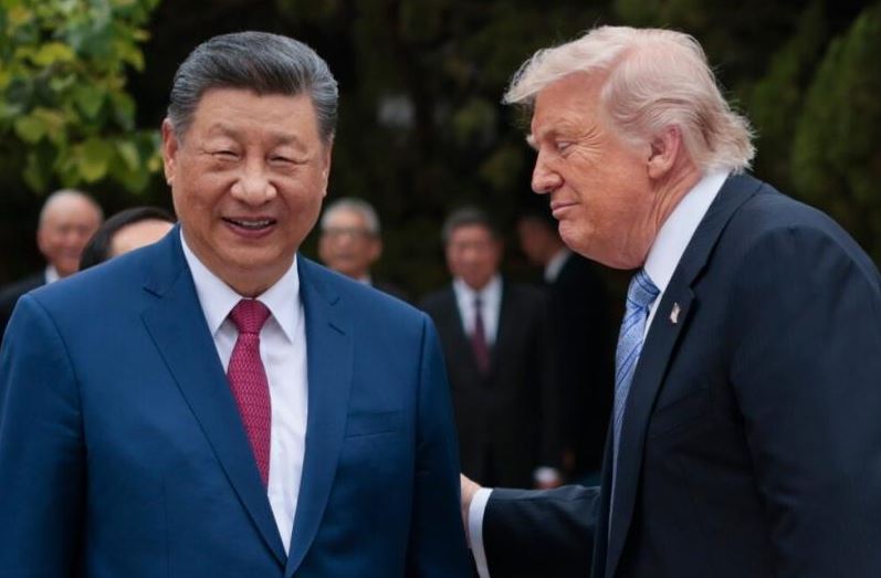 Two political leaders standing together at a diplomatic event, engaged in conversation outdoors.
