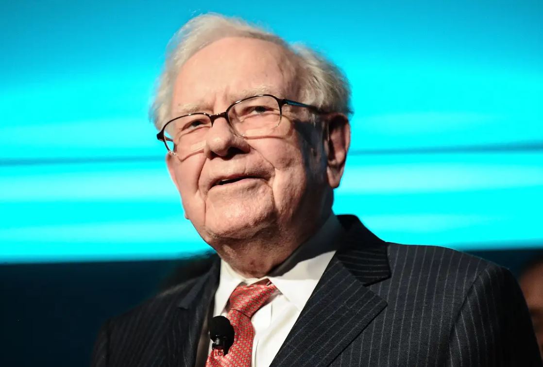 Warren Buffett speaking at an event as Berkshire Hathaway chairman and legendary value investor.