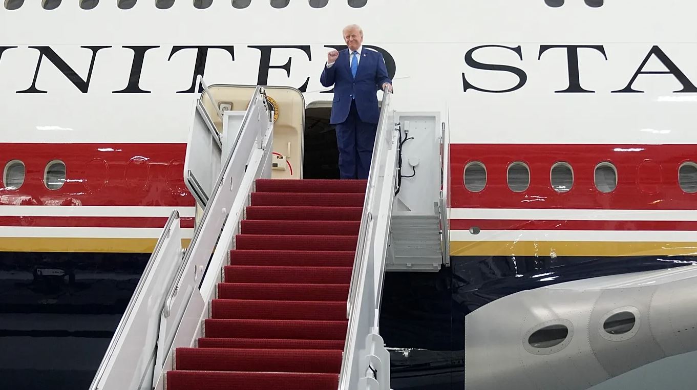 President Donald Trump aboard Air Force One following the White House announcement on the new U.S. aircraft import policy.